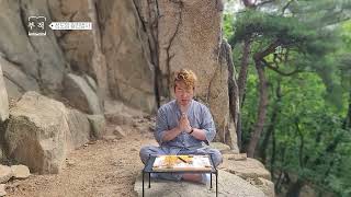 Gwangjin Buddhist monk of Seongdoam prays on a rock