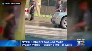 Video: Videos show NYPD officers being doused with water while responding to calls