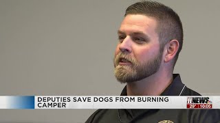 Deputies who saved 14 dogs from a burning camper speak out