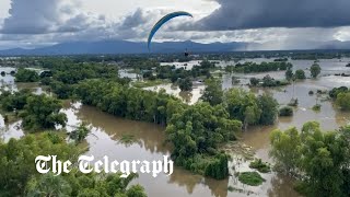 Thai rescuers airdrop supplies from powered parachutes in flood-stricken villages