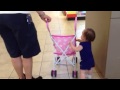 ella pushing the stroller