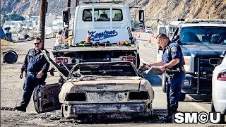 California Highway Patrol Officers Tow Burnt Vehicles Along PCH in Malibu After Devastating Blaze