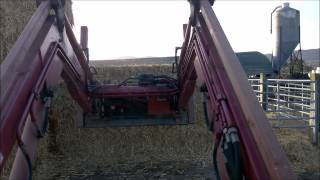 Unloading some bales