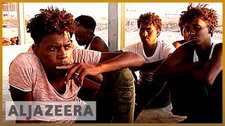 Libya to close migrant centres after criticism from UN