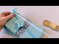 woven pouches on a cardboard loom