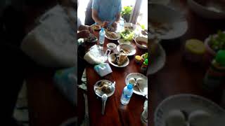 Noj tshais nyob Moos Paj Lais. Breakfast at PakLay District laos