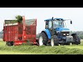 New Holland 8670 working in the field chopping grass w/ Taarup Forage Harvest | Silage Season 2021