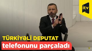Millət vəkili parlamentdə çəkiclə telefonunu sındırdı