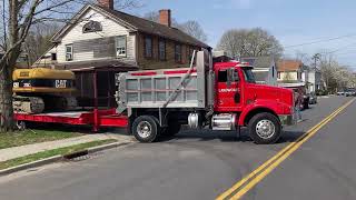 2002 Peterbilt 330 moving Caterpillar 315cl on 25 ton tag trailer