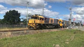 QRNational 2485H+IMU102 train coming past walker street in Bundaberg.