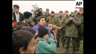 RUSSIA: CHECHNYA:  PREMIER PUTIN RALLIES TROOPS