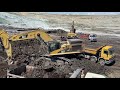 caterpillar 365c and caterpillar 365b excavators loading trucks