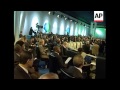 AP cover of heads of state arriving for summit, Merkel bite, pro Mugabe demo