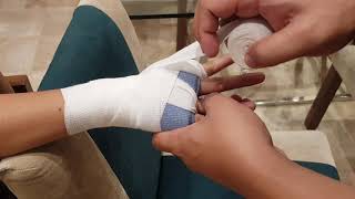 Wrapping hands using Winning VL-B Hand Wraps \u0026 Winning NG-2 Knuckle Guards