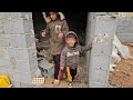 a cold stormy rainy day ali s nomadic family struggles to finish building the roof of their house