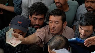 Afghans flock to passport office reopened by Taliban