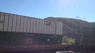 UP 5688 leads Eastbound Stack Train passes through Blue Cut CA