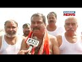 union minister dharmendra pradhan takes holy dip at maha kumbh 2025