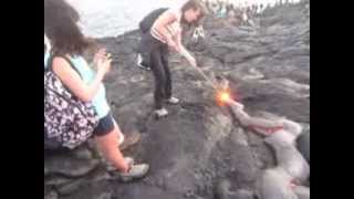 Poking lava with a stick in Hawaii