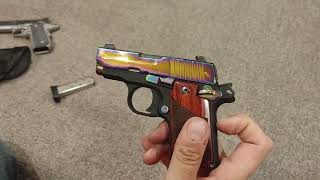 Tabletop review of a Sig P238 Rainbow Titanium