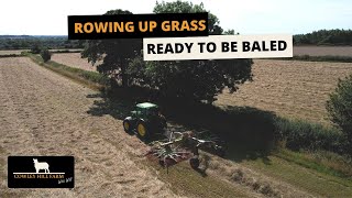 ROWING UP GRASS READY TO BE BALED