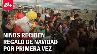 Niños pobres en Argentina reciben regalos por primera vez en su vida - N+