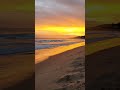 Sunset, waves, rainbow & surfers. Algarve, Portugal. Amazing Praia Da Luz