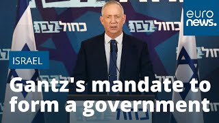 Israel opposition leader Gantz calls on PM Netanyahu to resign but supports unity government