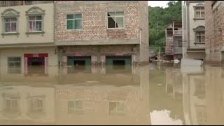 Flood Inundates Buildings, Farmland after Dike Break