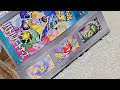 opening a bunch of pokemon cards from battle partners booster box