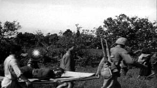 Japanese civilians cross a field in Aguni Jima, Okinawa, Japan. HD Stock Footage