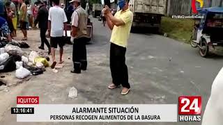 Iquitos: personas recogen alimentos de la basura