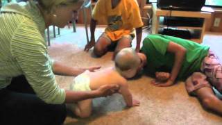 Mya with Tante and cousins learning to crawl