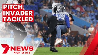 Gold Coast Titans investigating tackle of female pitch invader | 7NEWS