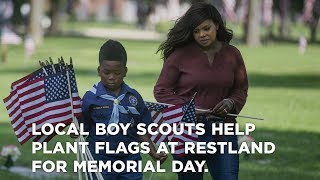 Local Boy Scouts help plant flags at Restland Funeral Home and Cemetery for Memorial Day.