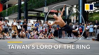 Taiwan’s ‘lord of the ring’ shows off giant metal hoop acrobatics