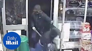 Prolific robber caught on CCTV raiding shop is back behind bars - Daily Mail