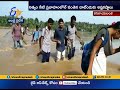 Villagers Travelling Dangerously | in Flood Water | at Kanakayalanka of West Godavari Dist