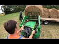 hauling hay 5075e and the 3032e