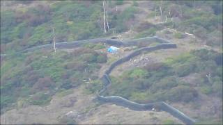 父島から見える兄島のグリーンアノール防除柵