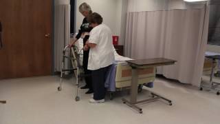 Assisting with ambulation for a resident using a walker