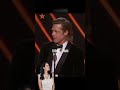 brad pitt being applauded at the oscars ceremony.