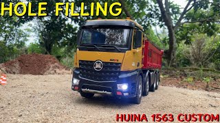 STORY: HUINA 1563 filling the hole with sand