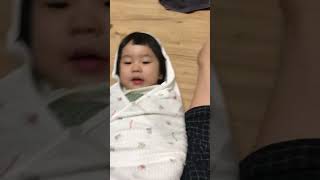 a child imitating a baby