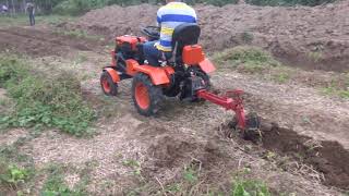 Mini tractor with single row plough