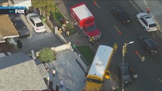 School bus crashes into cars, home in South LA