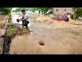 Volunteers Unblock Storm Drains to Rescue the City from Flash Floods