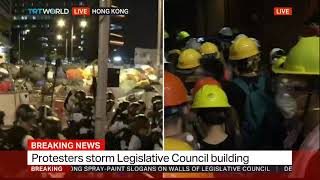 Riot police approaches Hong Kong parliament and protestors storm it