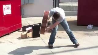 Smashing an Acoustic Guitar