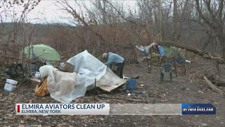 Elmira Aviators help cleanup wooded trails along Chemung River